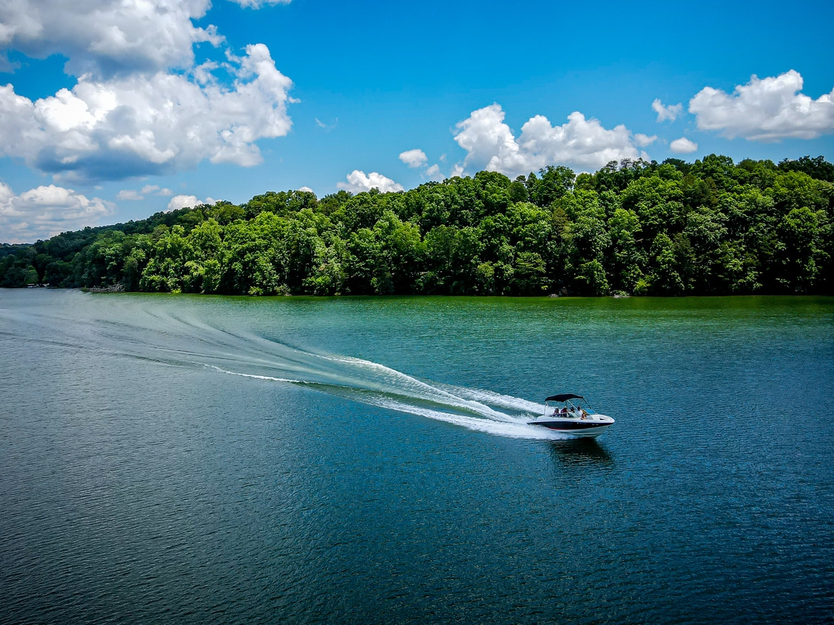 Boat racing across a lake