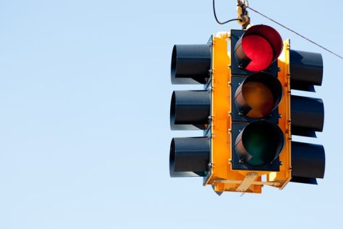 A red light traffic signal with blue sky copy space concept